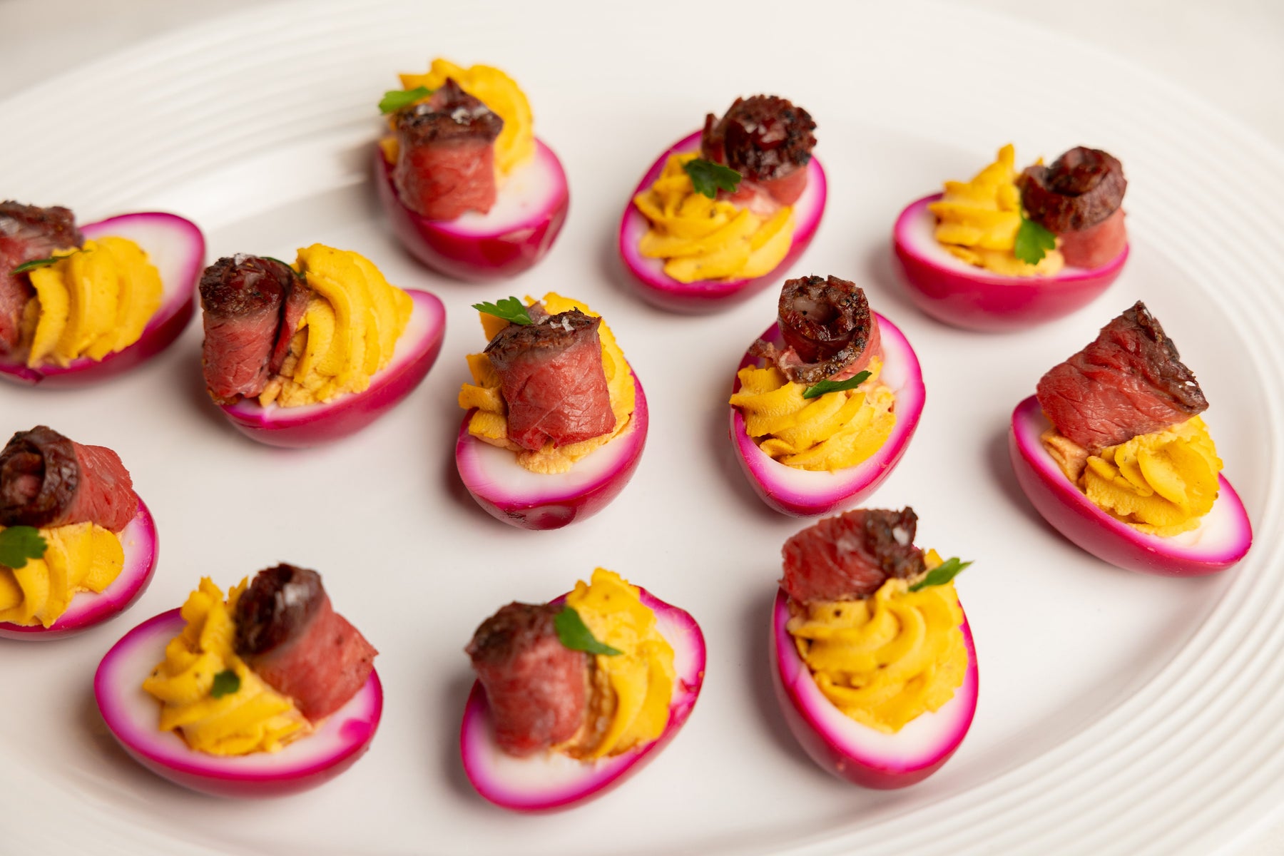 Pink Deviled Eggs With Steak